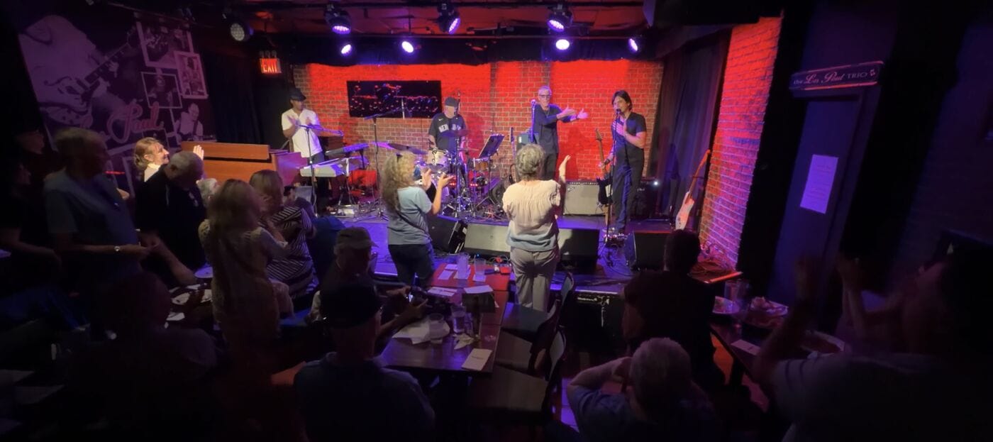 The audience on their feet applauding the Davide Pannozzo Group at Iridium NYC, August 6 2026.
